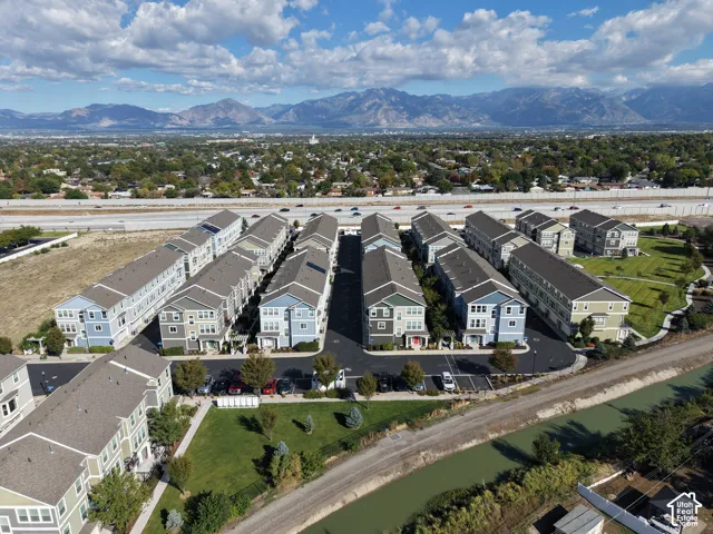 Townhome-style residences featuring multi-level construction, distinct architectural styles, and varied exterior color palettes