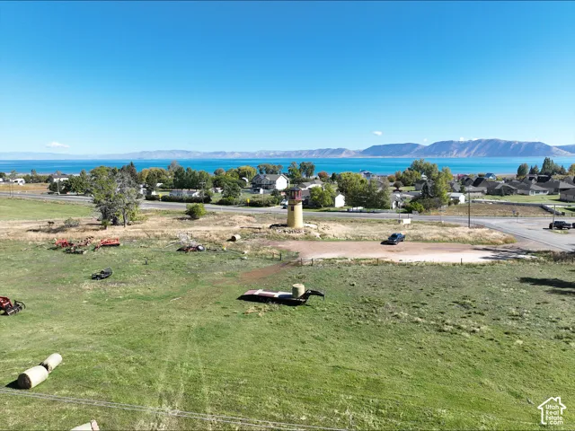 Expansive acreage featuring native grasses, a dedicated structural lighthouse, and mountain and water scenery