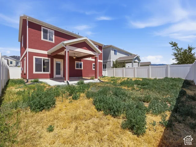 Red stucco exterior with white trim