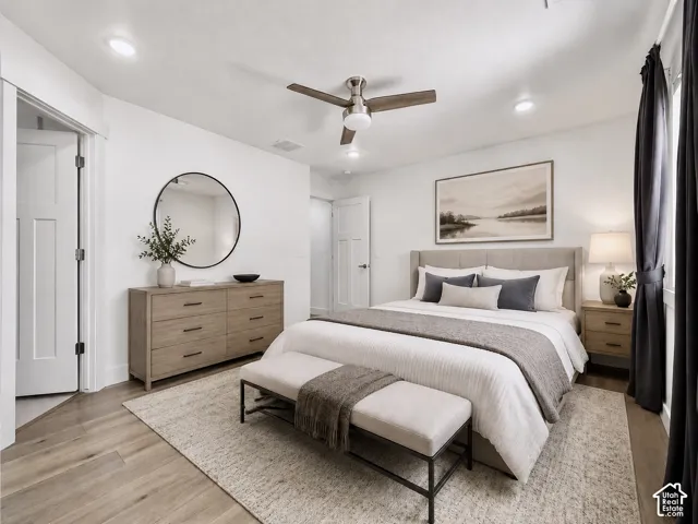 Light wood-finish flooring with a textured area rug