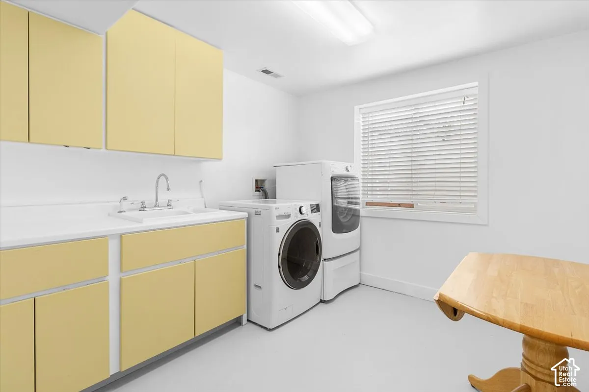 Full-height cabinetry, integrated sink, and white countertop