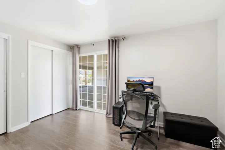 Light wood-finish flooring with white walls