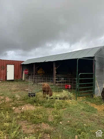 Metal-clad outbuilding with an arched roof