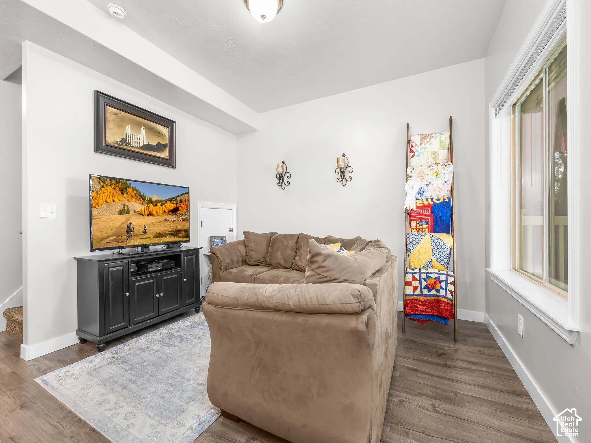 Wood-finish flooring with crisp white baseboards