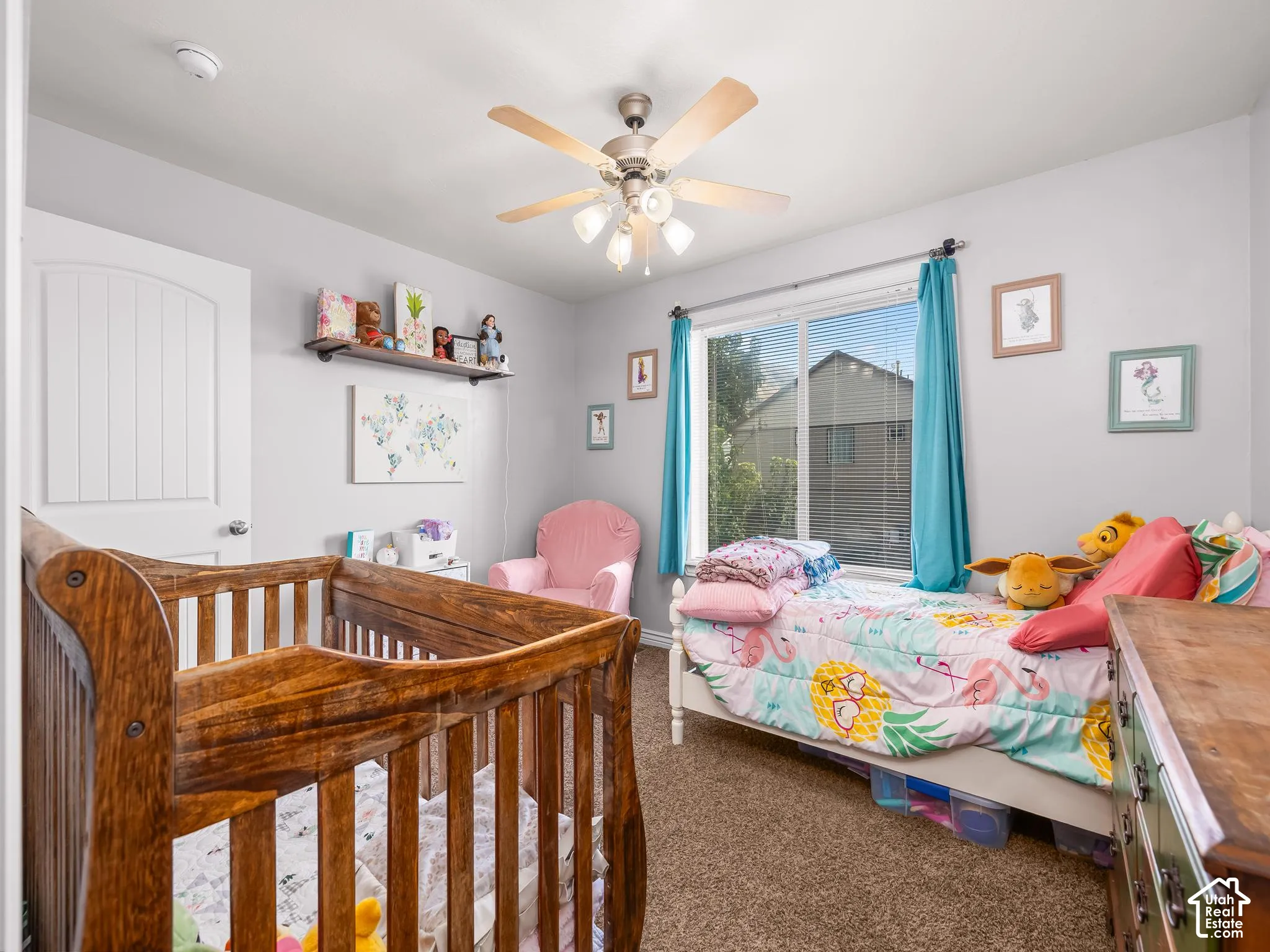 Wall-to-wall carpeting, overhead ceiling fan with light, and a window with blinds