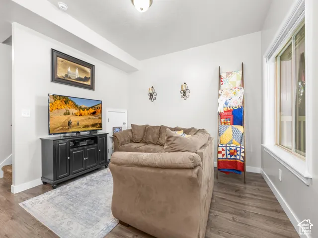 Wood-finish flooring with crisp white baseboards