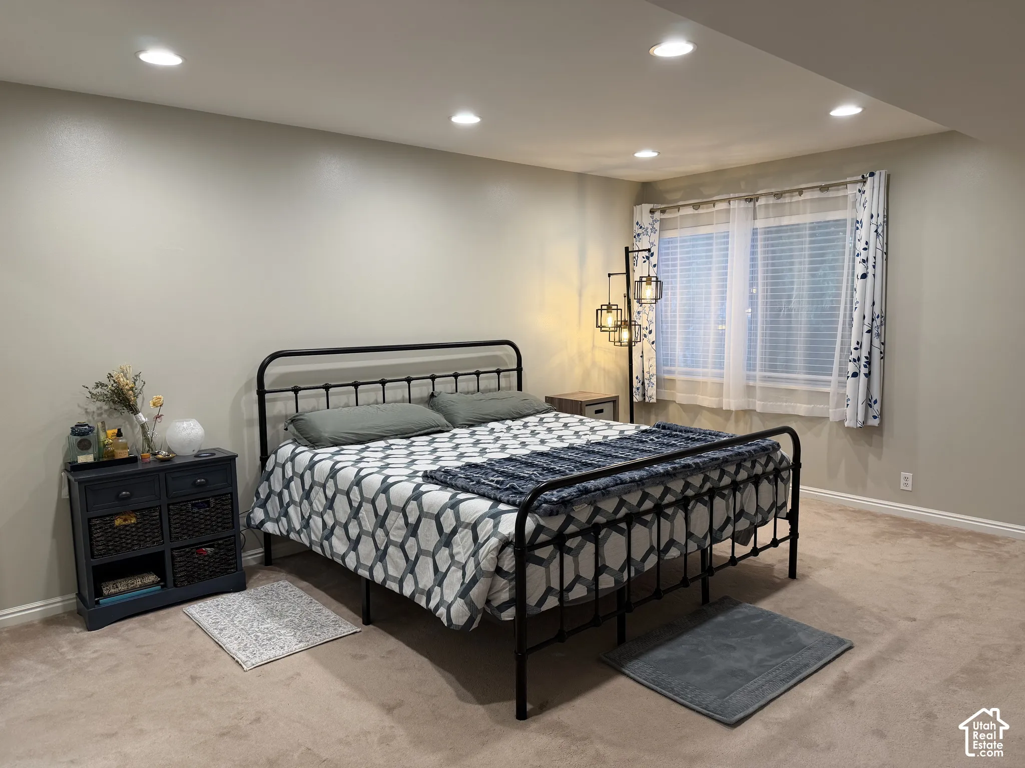 Recessed ceiling lighting, wall-to-wall carpeting, and baseboard trim