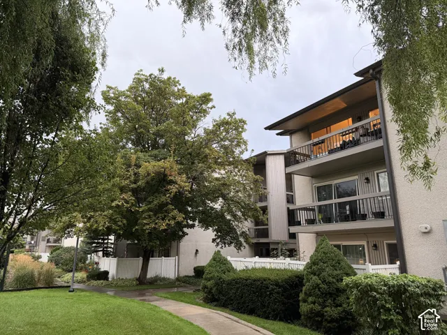 Multi-level building with exterior balconies and sliding glass doors