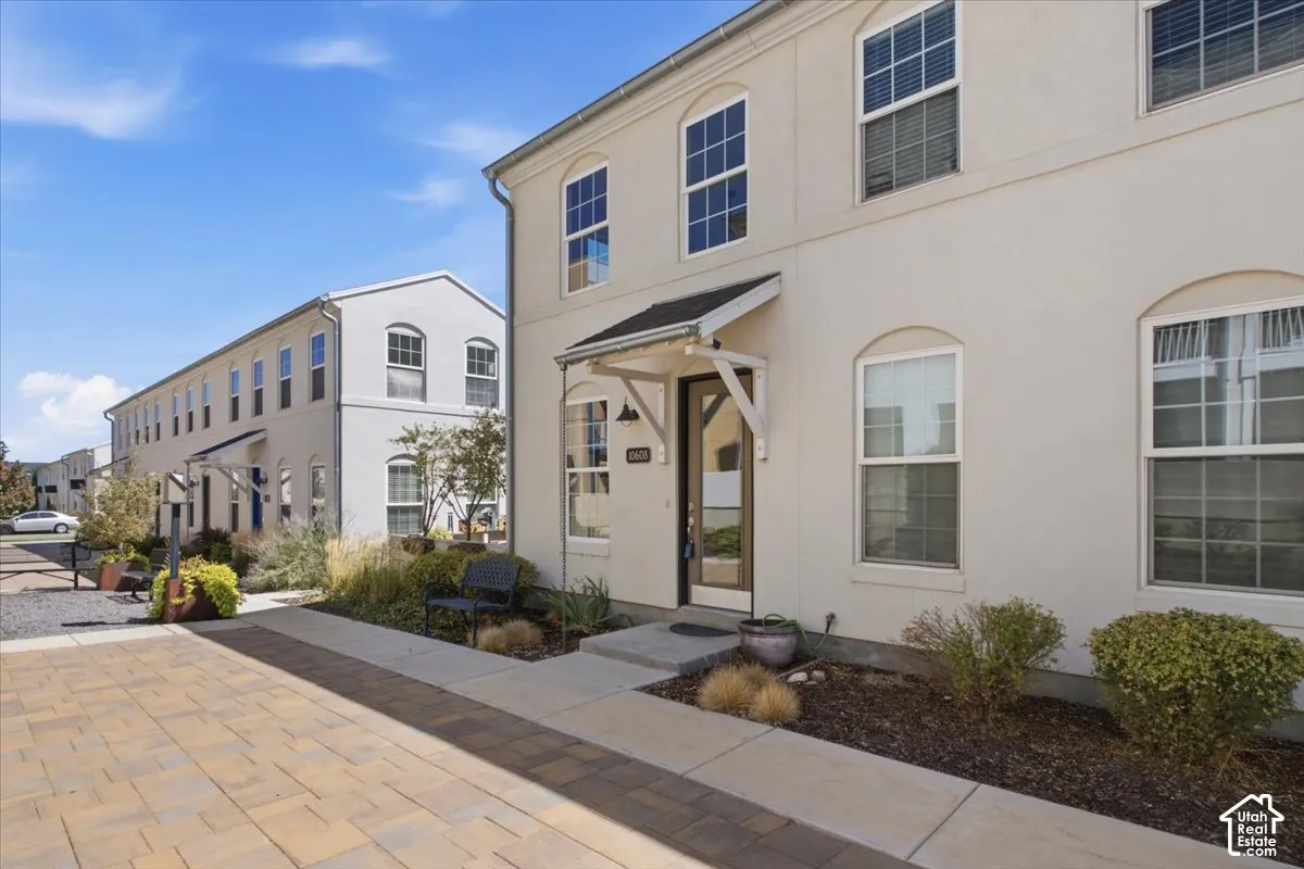 Stucco exterior with multiple arched and rectangular windows