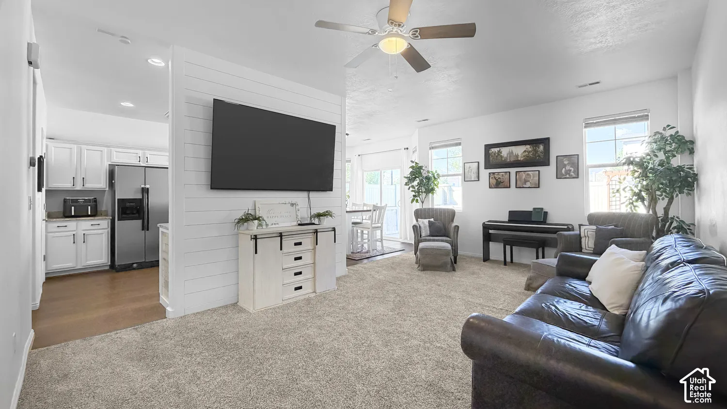 White shiplap accent wall with media console