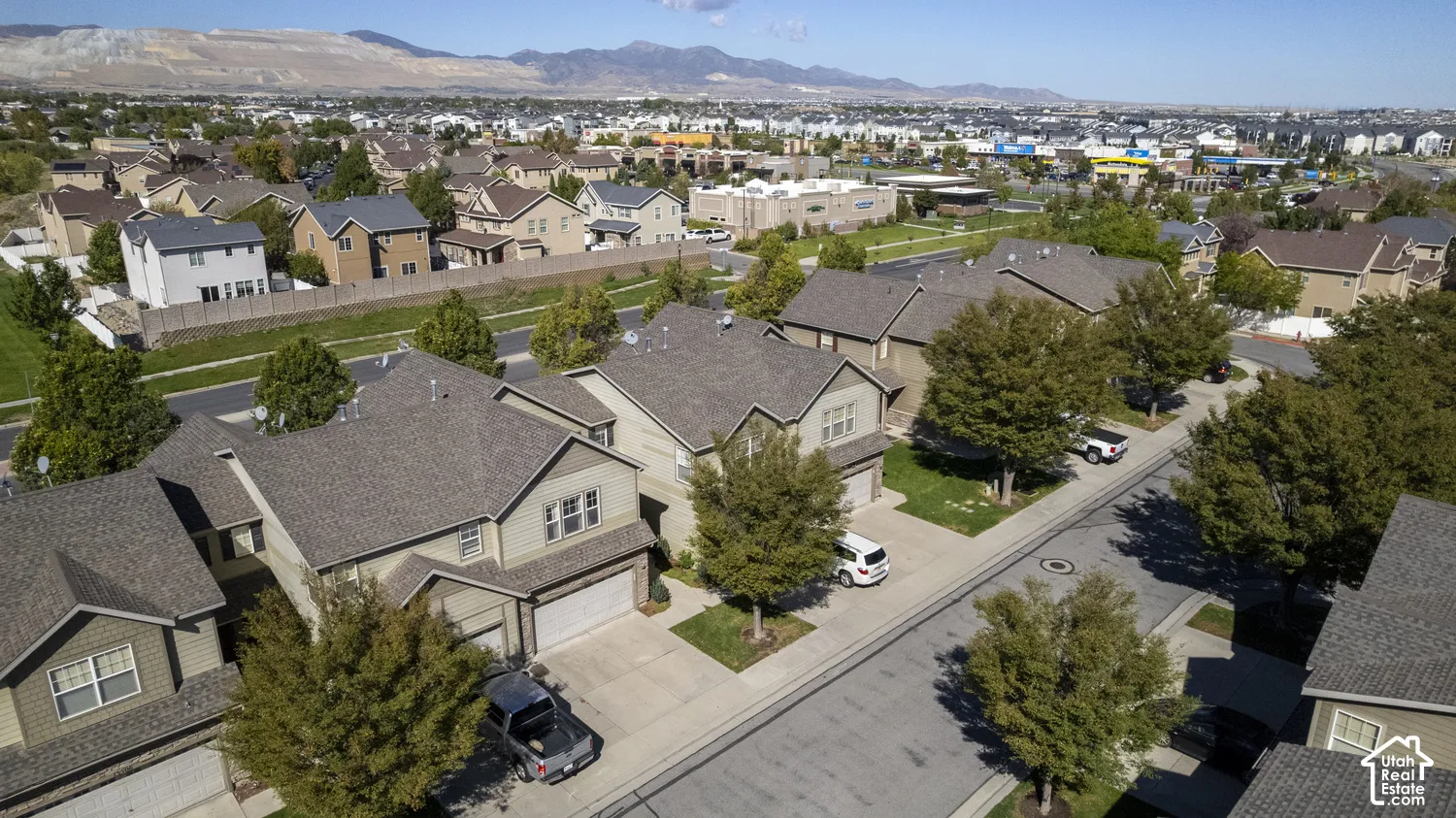 Suburban neighborhood featuring varied architectural styles and mature trees