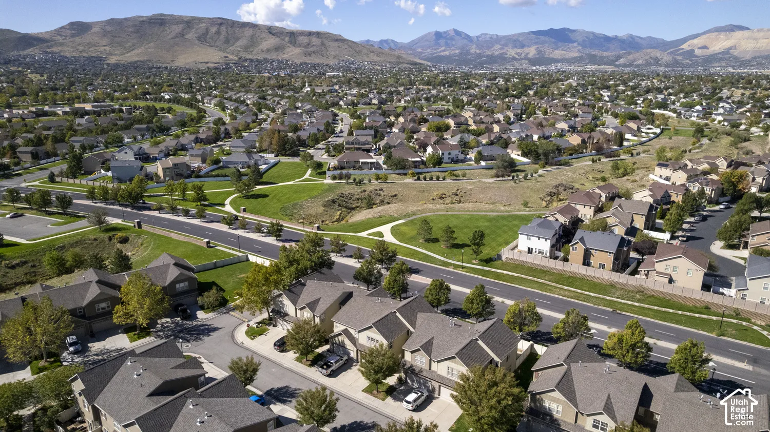 Expansive residential development featuring paved roads and mature landscaping