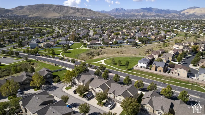 Expansive residential development featuring paved roads and mature landscaping