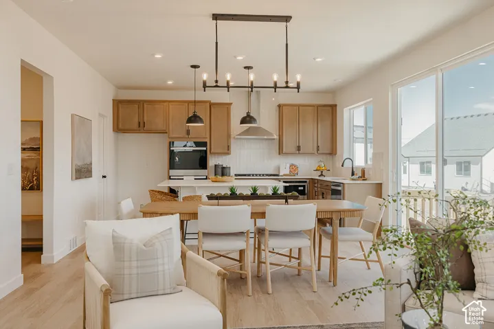 Open-concept living space with wood-finish flooring