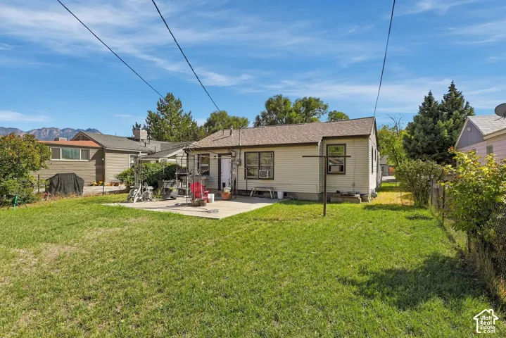 Expansive lawn area with a concrete patio