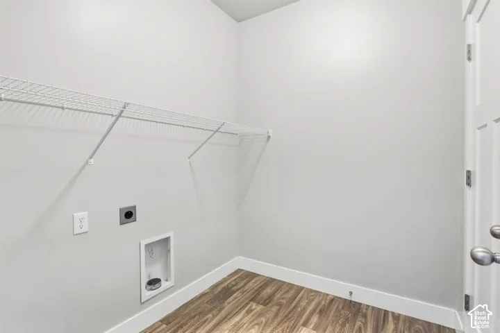Wire shelving, wood-finish flooring, and a paneled door