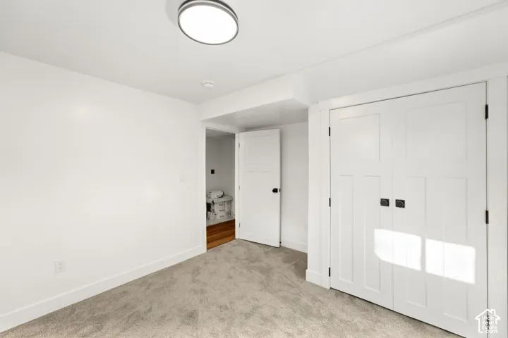 Grey carpeted flooring with white trim