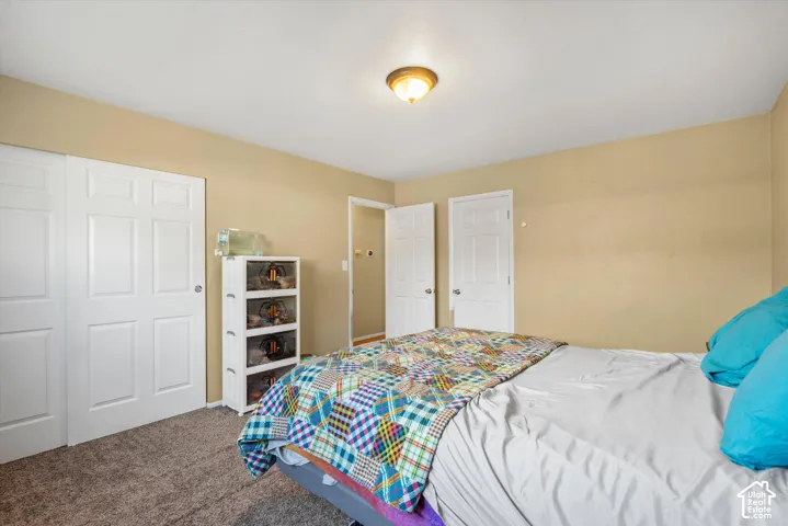Neutral wall finishes, recessed panel doors, and overhead lighting fixture