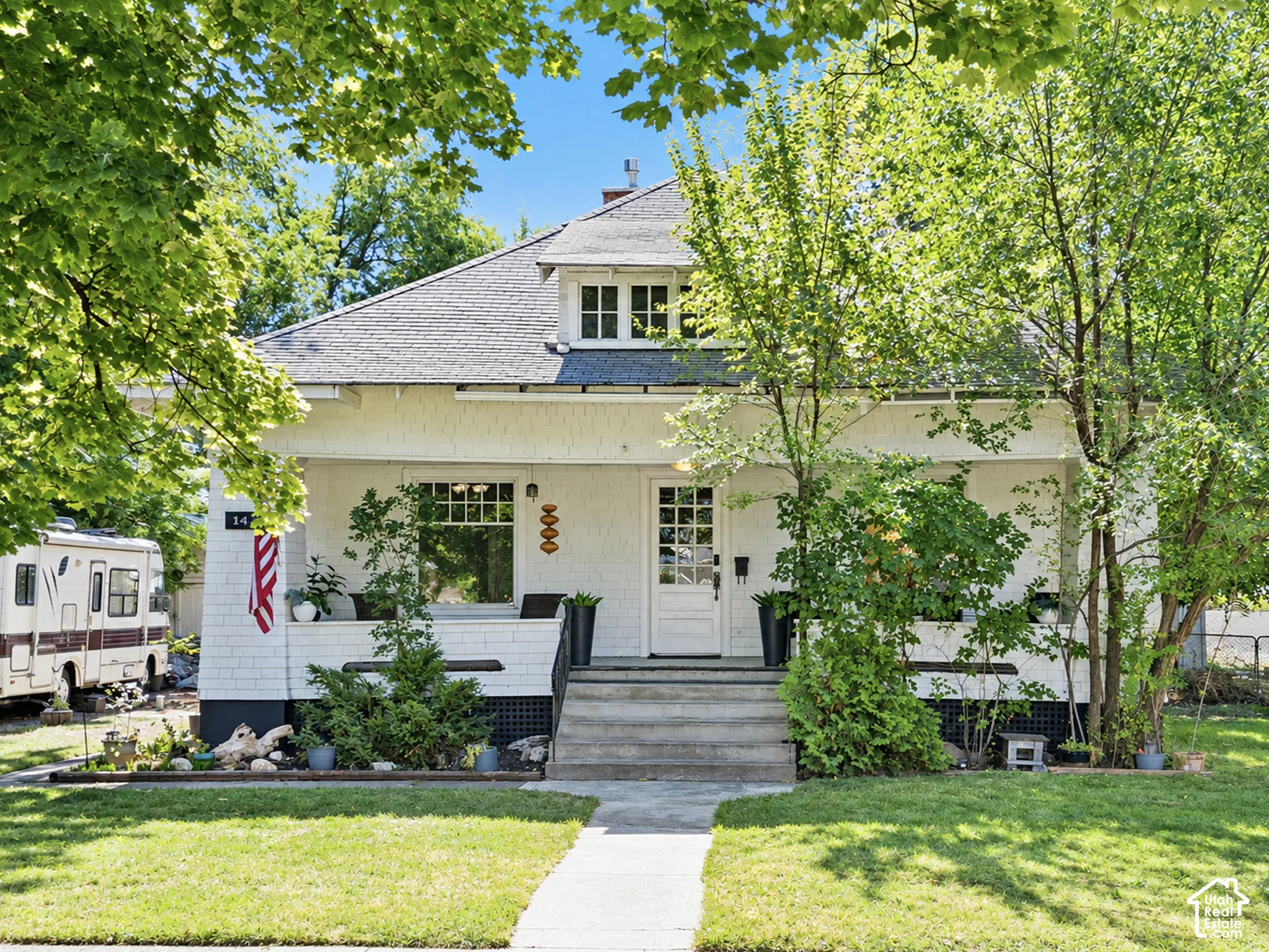 Wide stairway leading to double, covered front porch