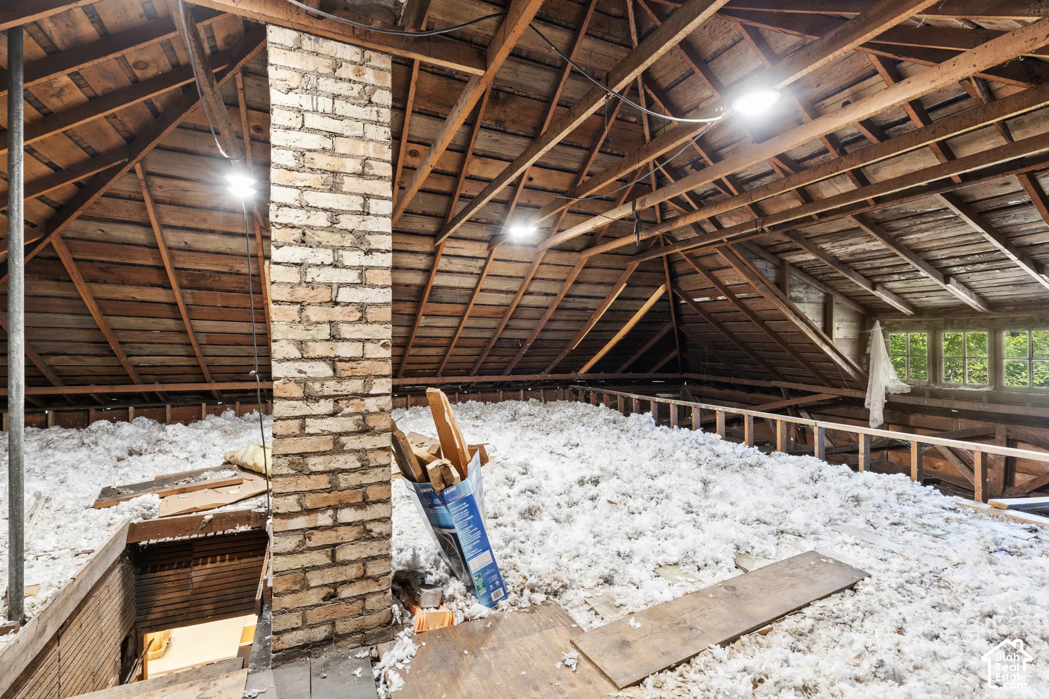 Roughly 1,000 sq feet unfinished attic space with staircase access from dining room