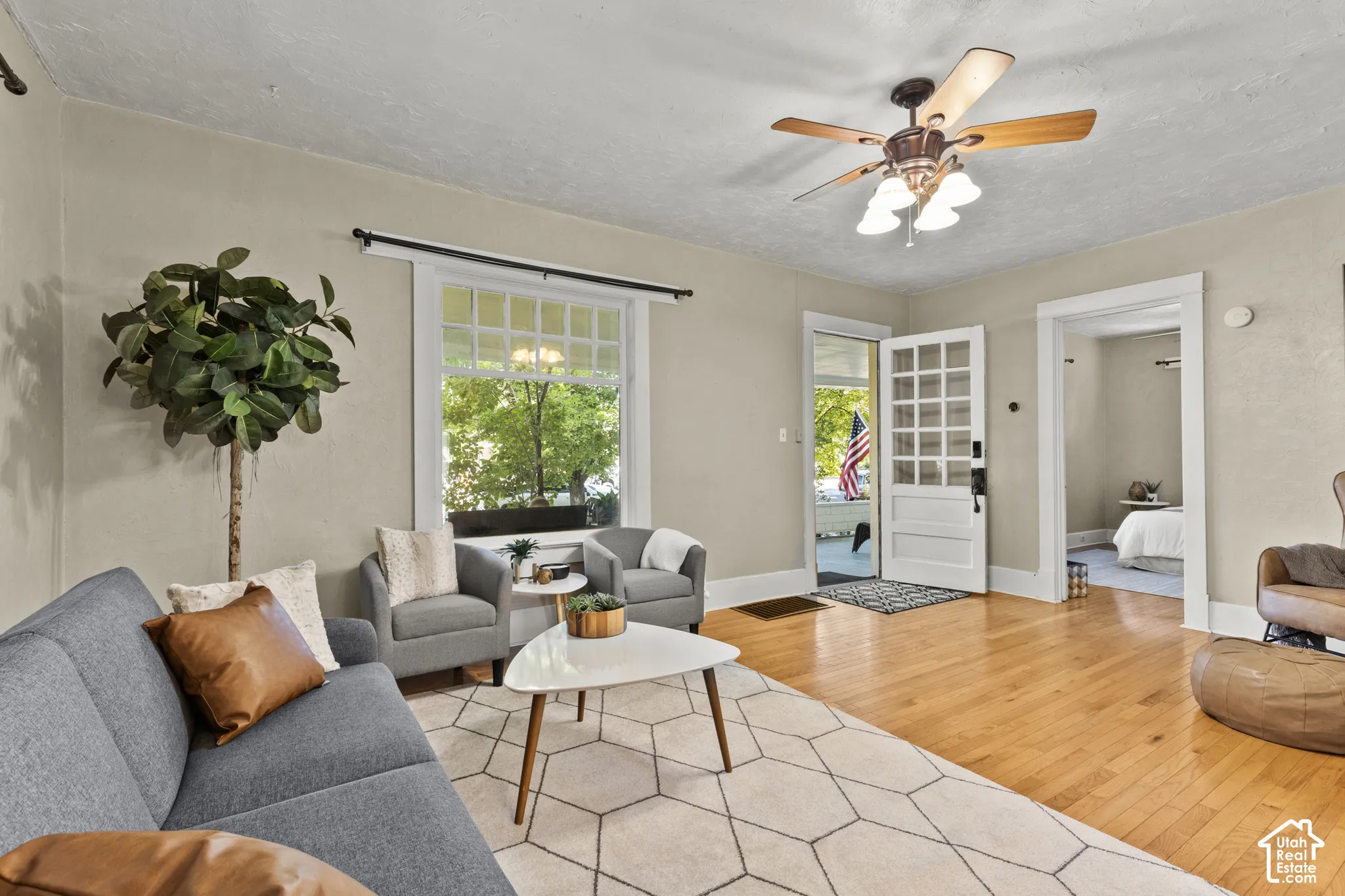 Living room looking onto front porch and primary bedroom