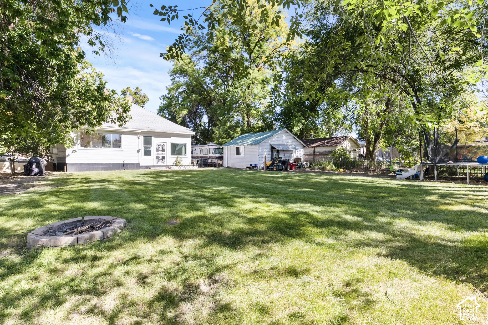 Stone-lined fire pit, detached garage