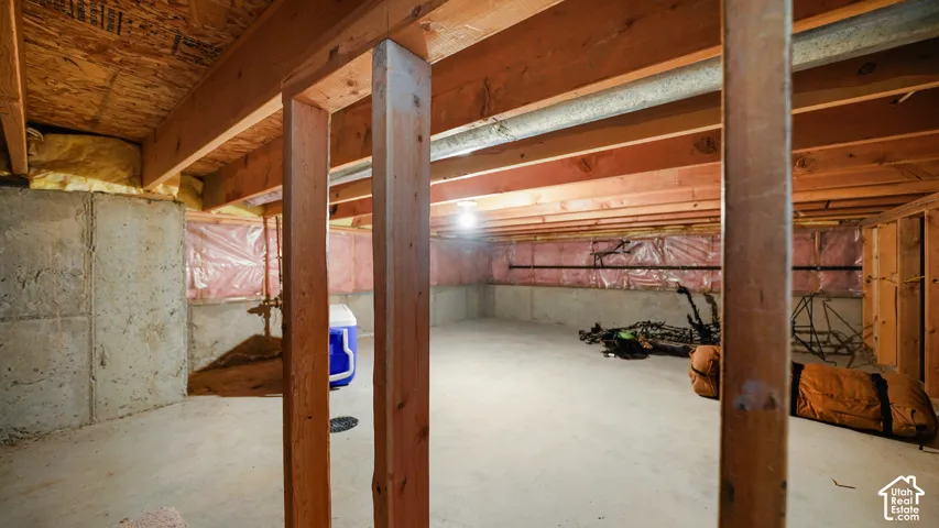 Concrete foundation walls and flooring with exposed wood framing