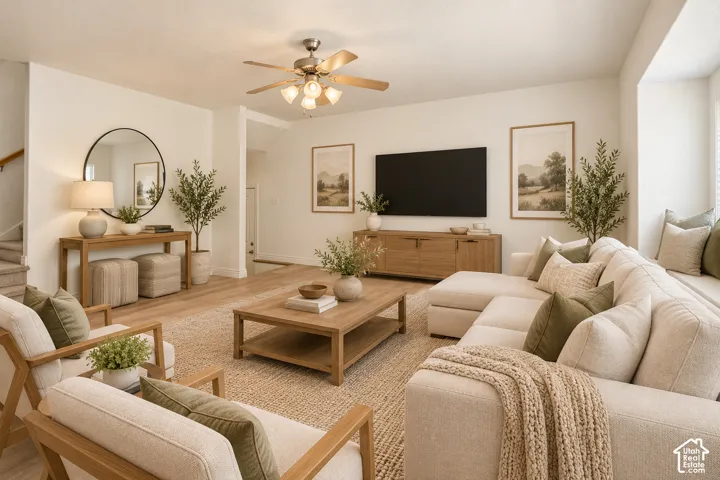 Spacious living area featuring wood-finish flooring, a ceiling fan with integrated lighting, and a built-in window seat VIRTUALLY STAGED