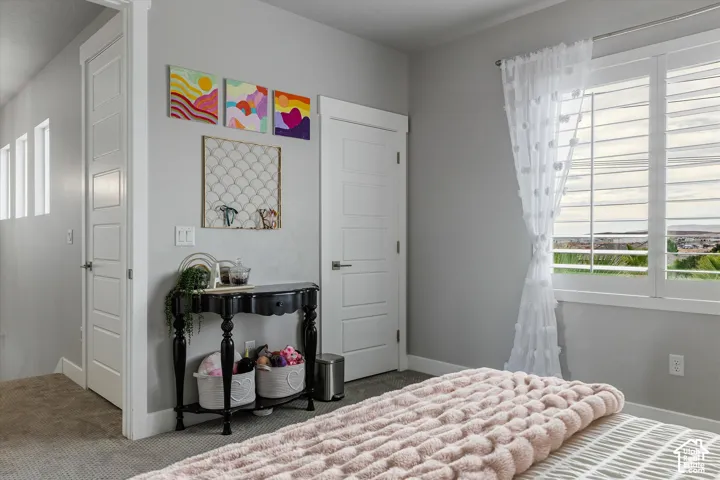 Wall-mounted window shutters, three horizontal panel doors, and neutral wall paint