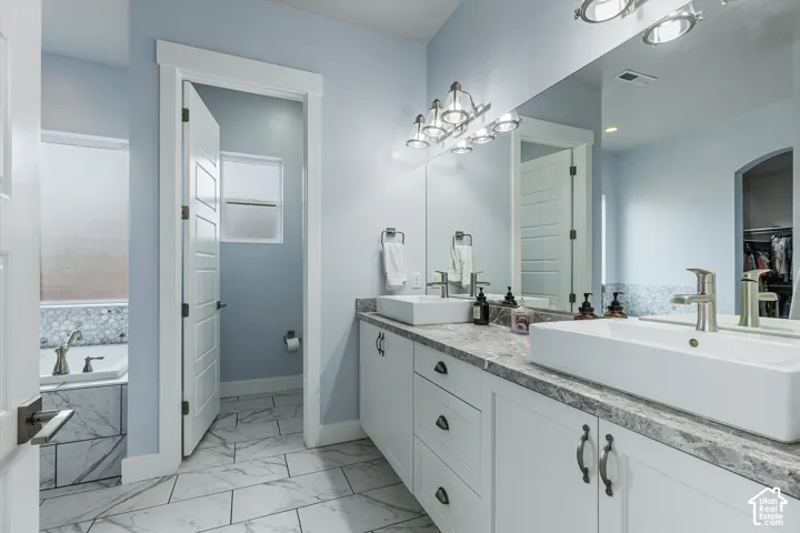 Dual vessel sinks with brushed nickel fixtures
