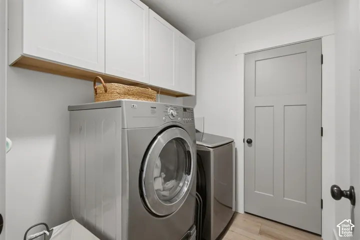 Laundry room with cabinets.