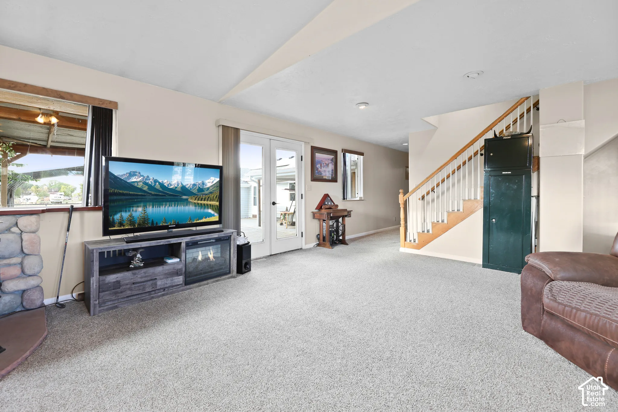 Plush carpeting and a stone-clad hearth