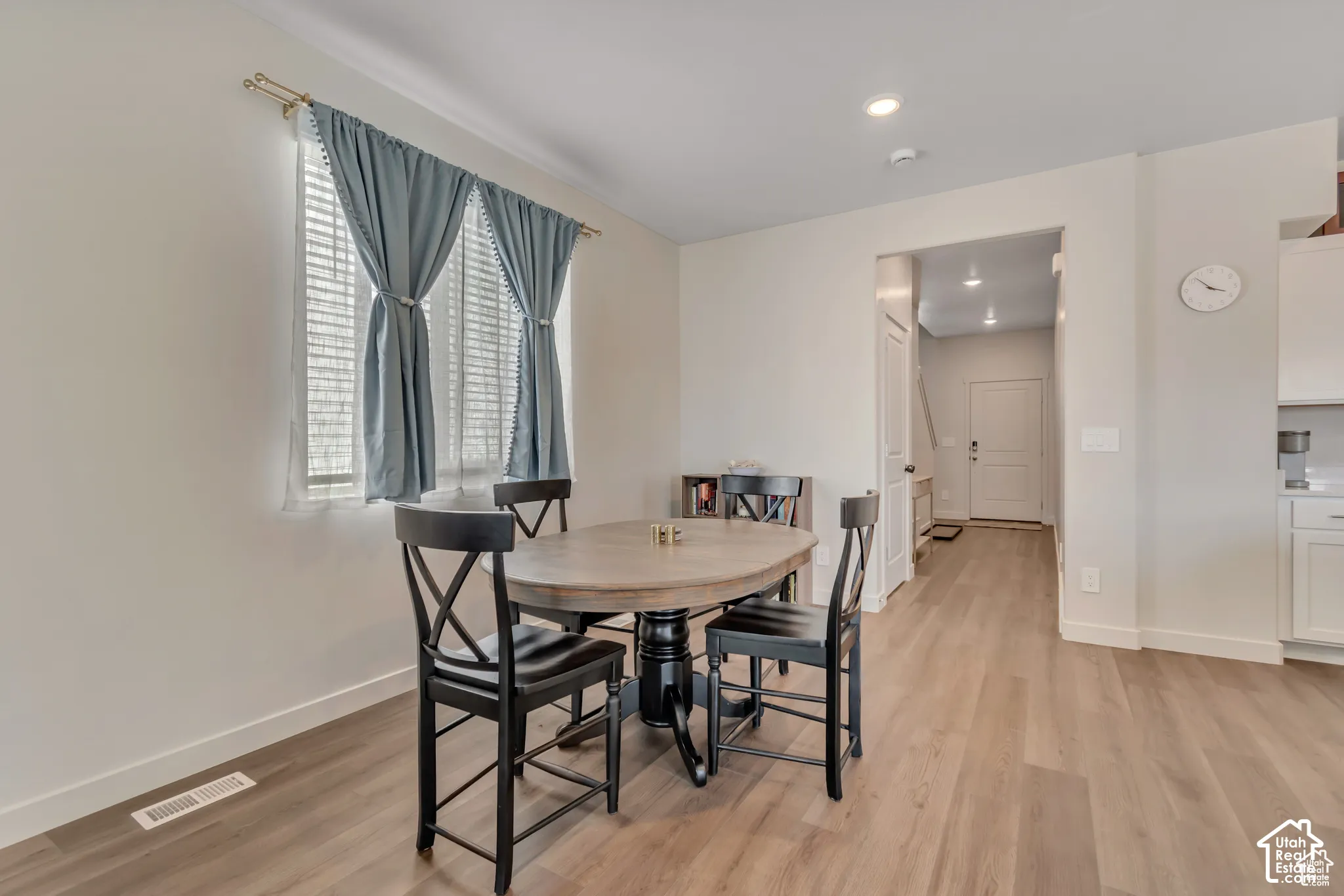 Neutral wall finishes with wood-finish flooring