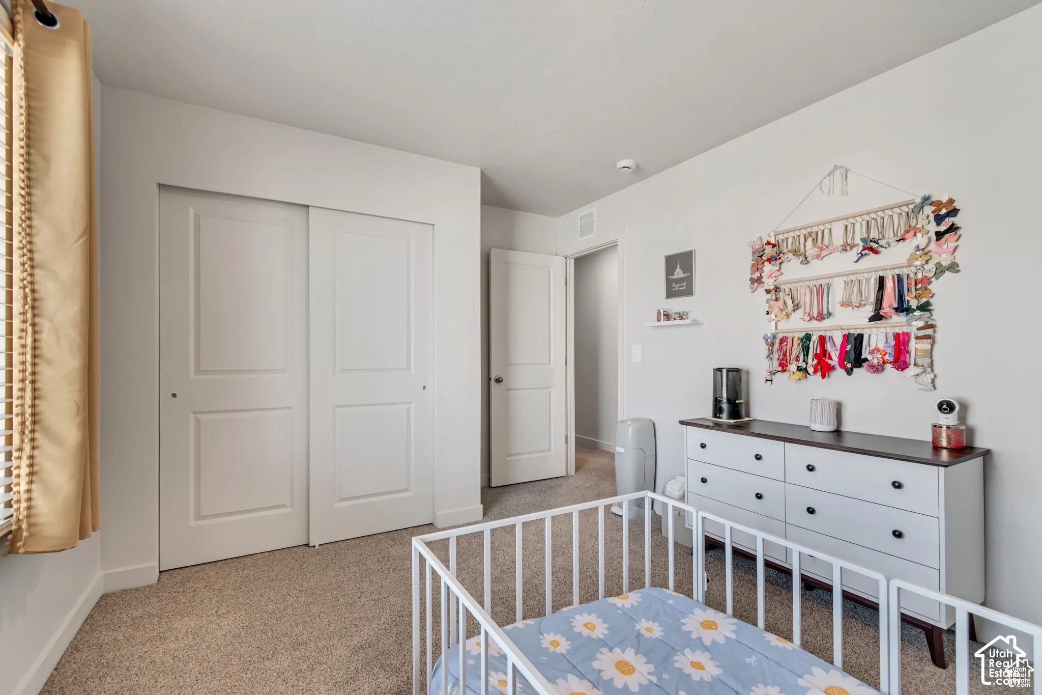 Neutral wall paint, textured carpet flooring, white sliding closet doors, and recessed lighting