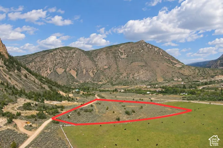 Expansive land parcel with surrounding mountains