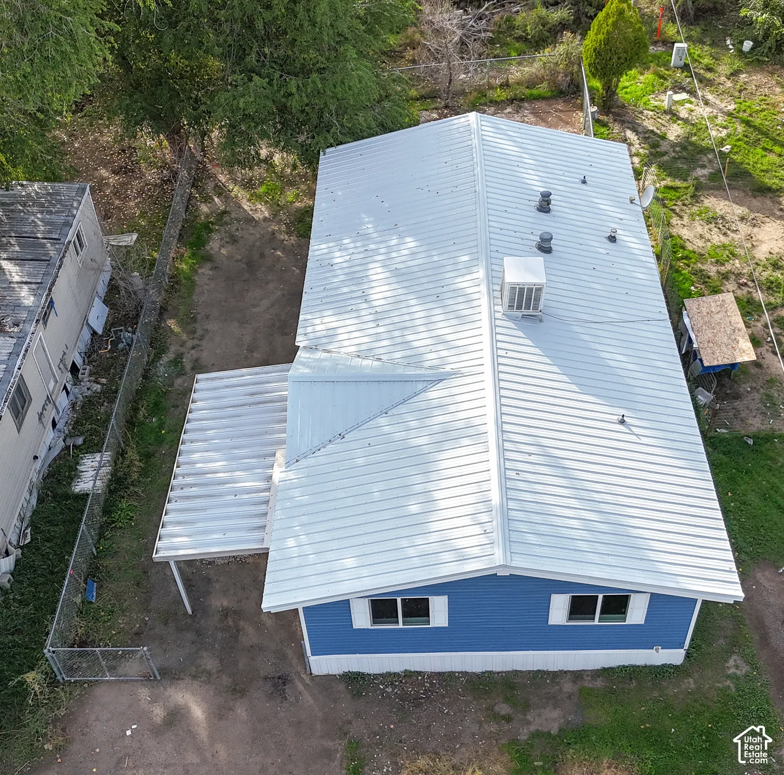 Blue exterior siding with white trim