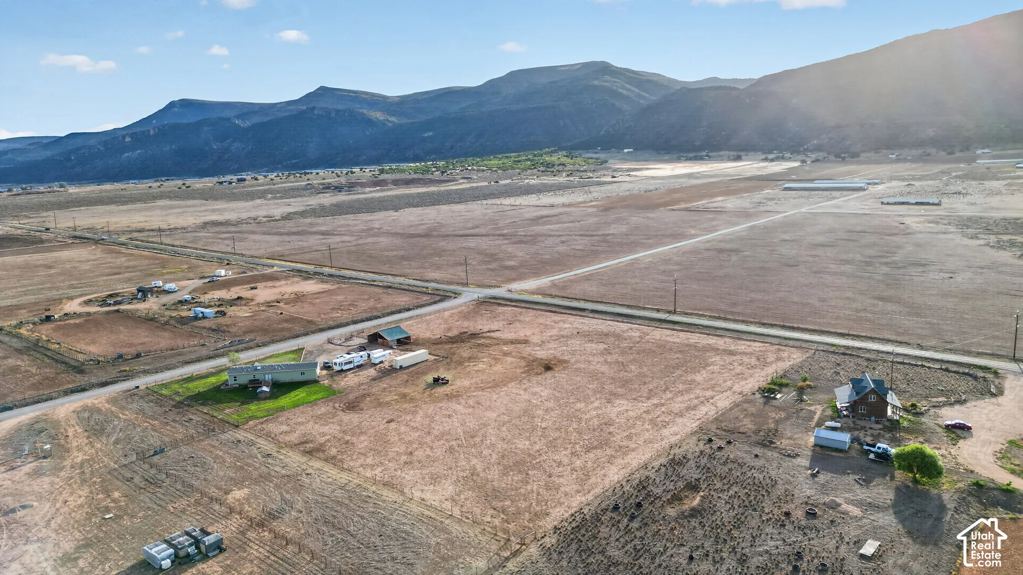 Expansive land parcels with distant mountain backdrops