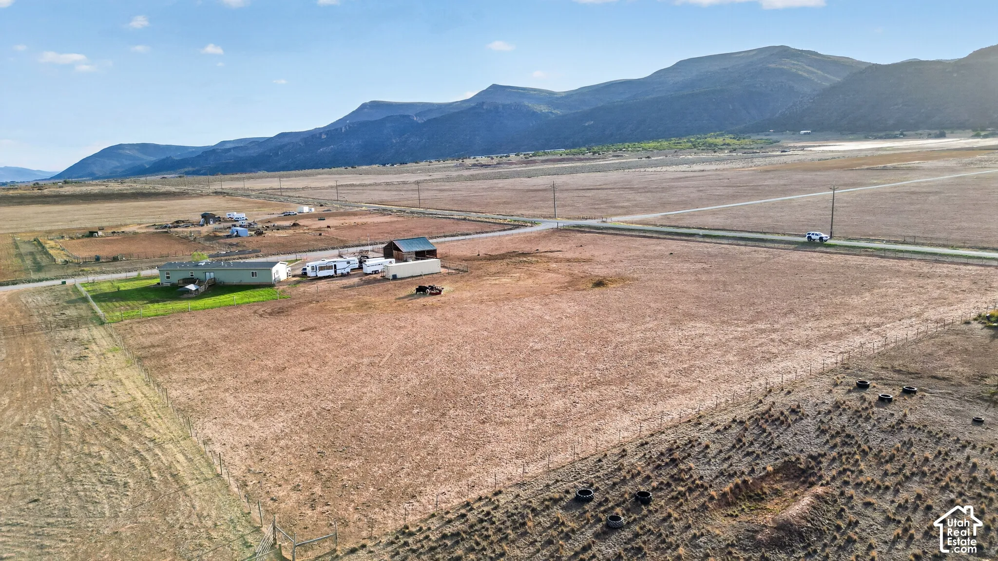 Expansive land parcel with distant mountain backdrop