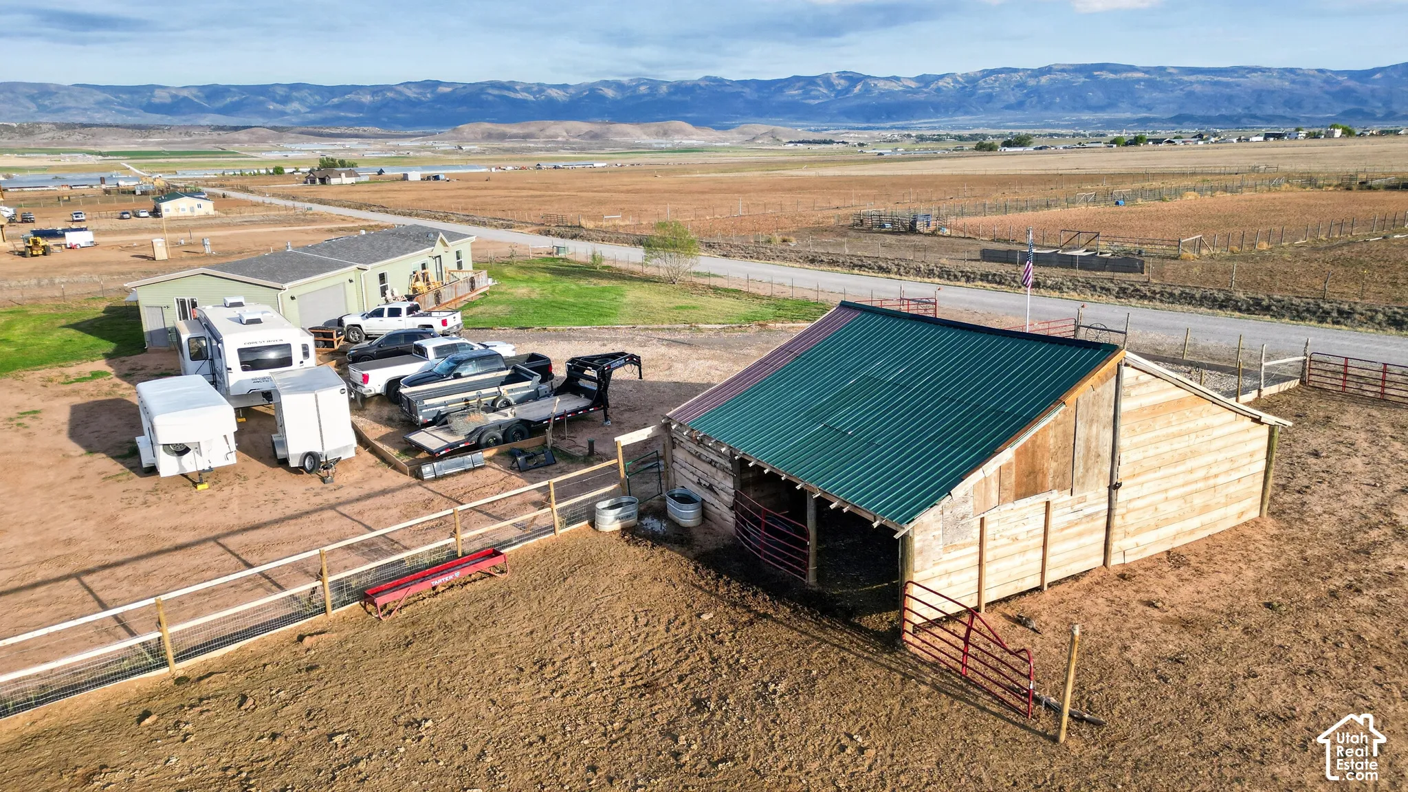 Barn with a green metal roof and wood siding