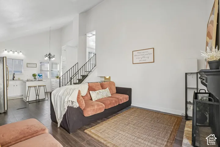 Vaulted ceilings and wood-finish flooring create an open living space