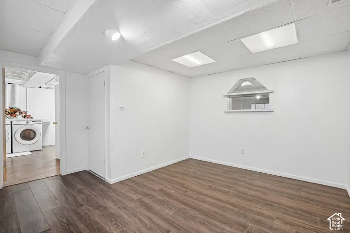 Wood-finish flooring with white walls and a white ceiling