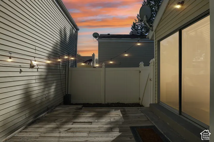 Private outdoor space featuring a wood deck surface and privacy fencing