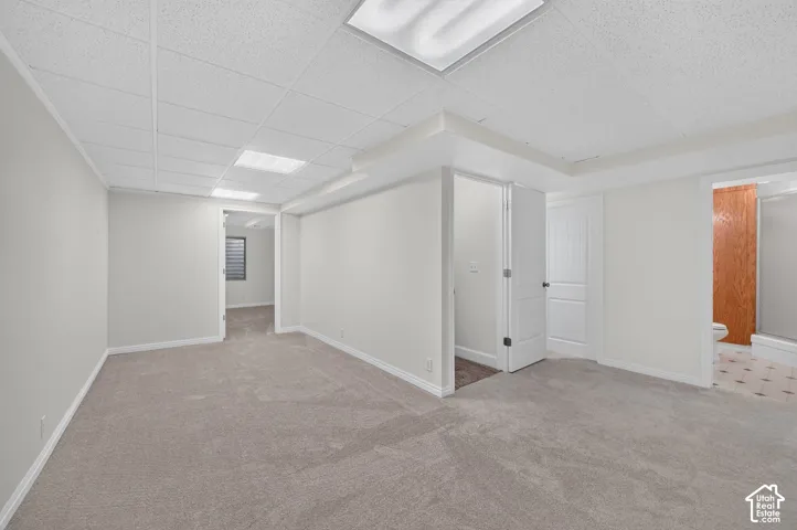 Carpeted flooring, recessed lighting, and white interior doors