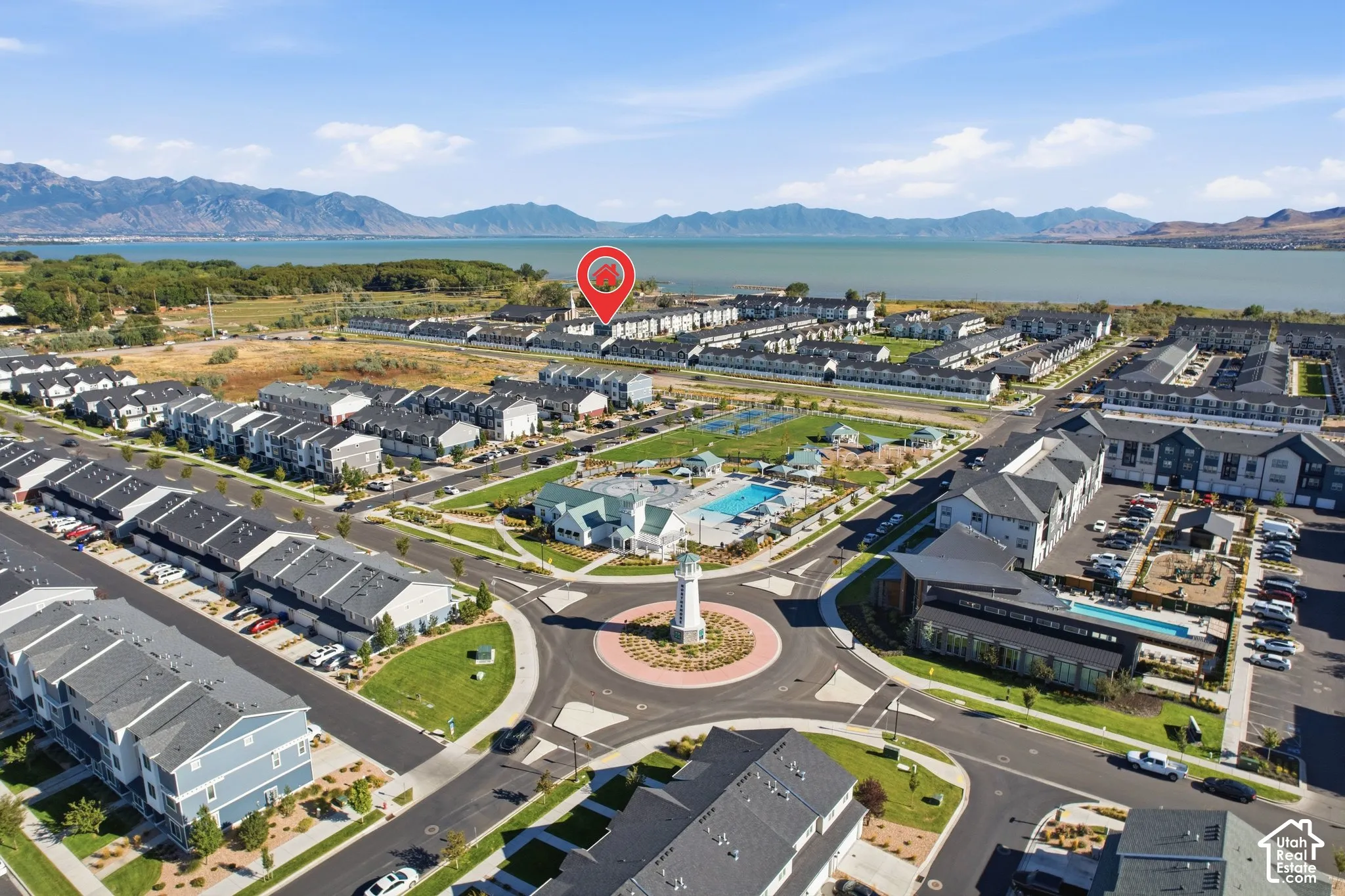 Aerial perspective showcasing a community with structured street layouts and a central roundabout