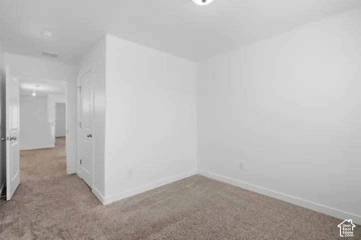 Neutral tone carpeting throughout