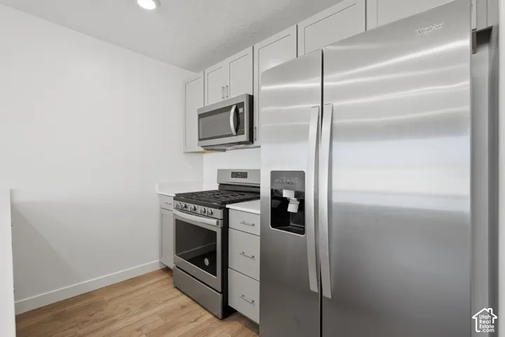 Stainless steel refrigerator, microwave, and range