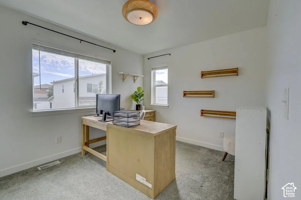 Bright room featuring a large window, a smaller window, and a woven ceiling light fixture