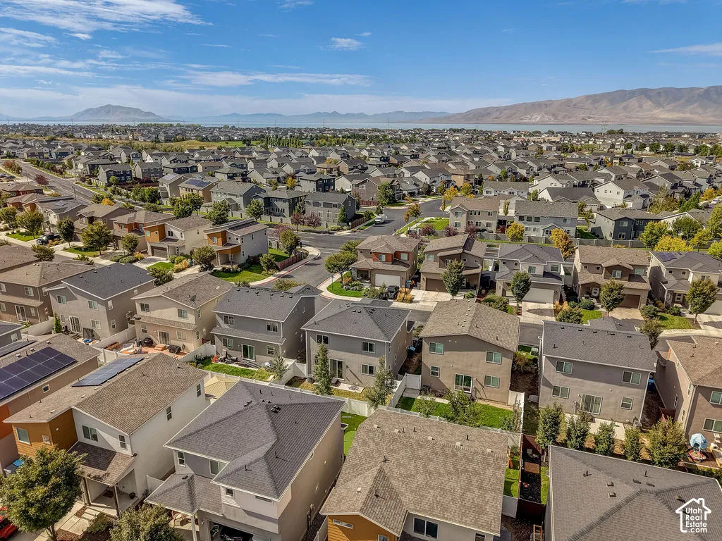 Residential neighborhood featuring single-family homes with multi-tone exteriors and various roof types