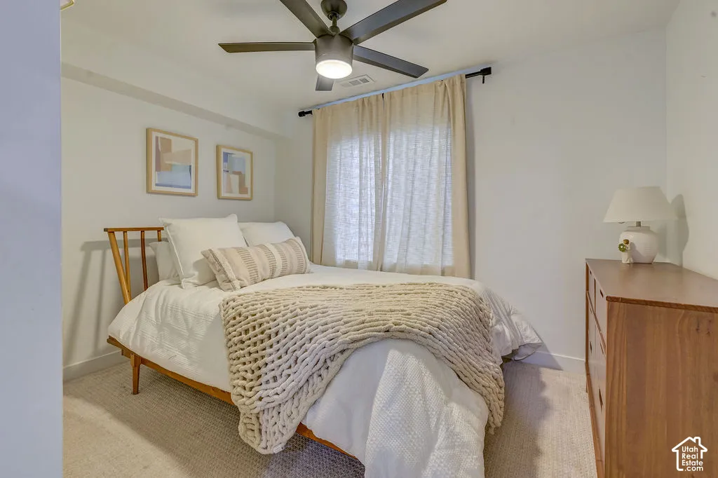 Neutral wall finishes, recessed lighting, and a contemporary ceiling fan
