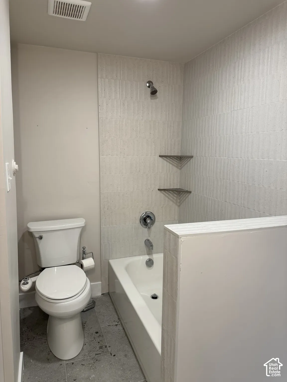 New basement full bathroom with tile surround